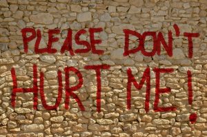 Brick wall with "Don't Hurt Me!" written